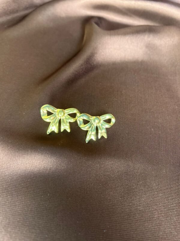 Golden bow studs